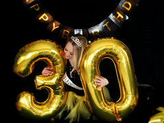 IWERP 60th birthday decorations in gold create a radiant backdrop.
