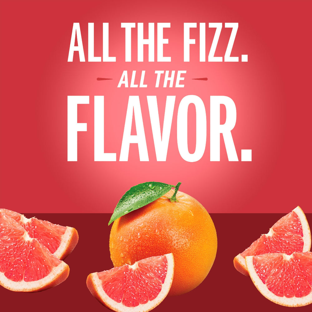 IZZE Grapefruit sparkling juice in a glass, ideal for sharing at gatherings.