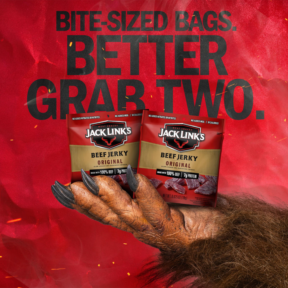 Jack Link's Original Beef Jerky hardwood-smoked seasoning detail on jerky.