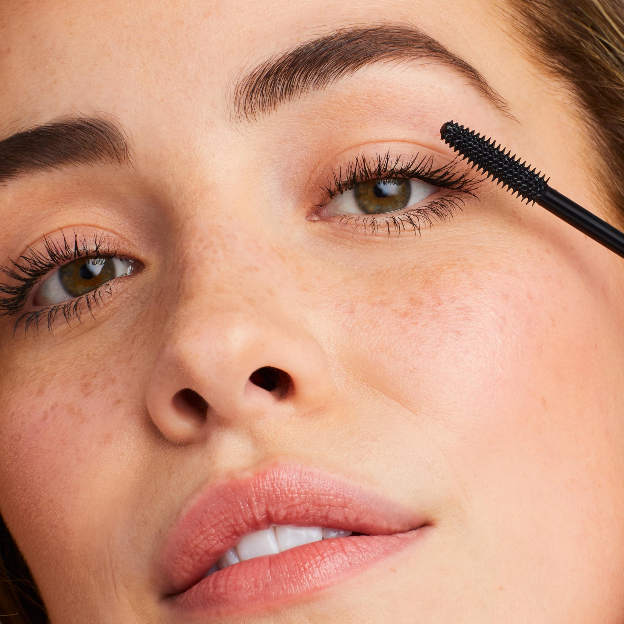Close-up of Jane Iredale Lash Fixation brush detail for precise root-to-tip application.