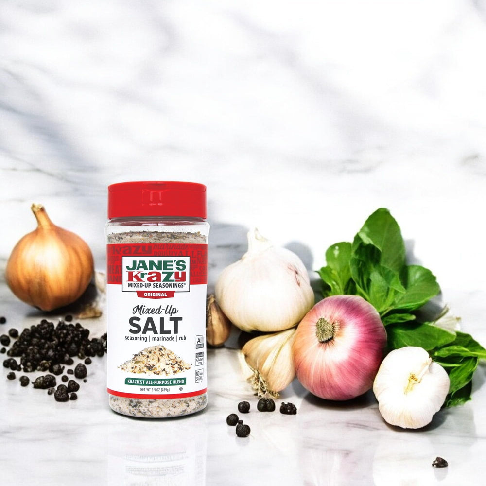 Pouring Jane's Krazy Mixed-Up Salt for a quick marinade flavor boost