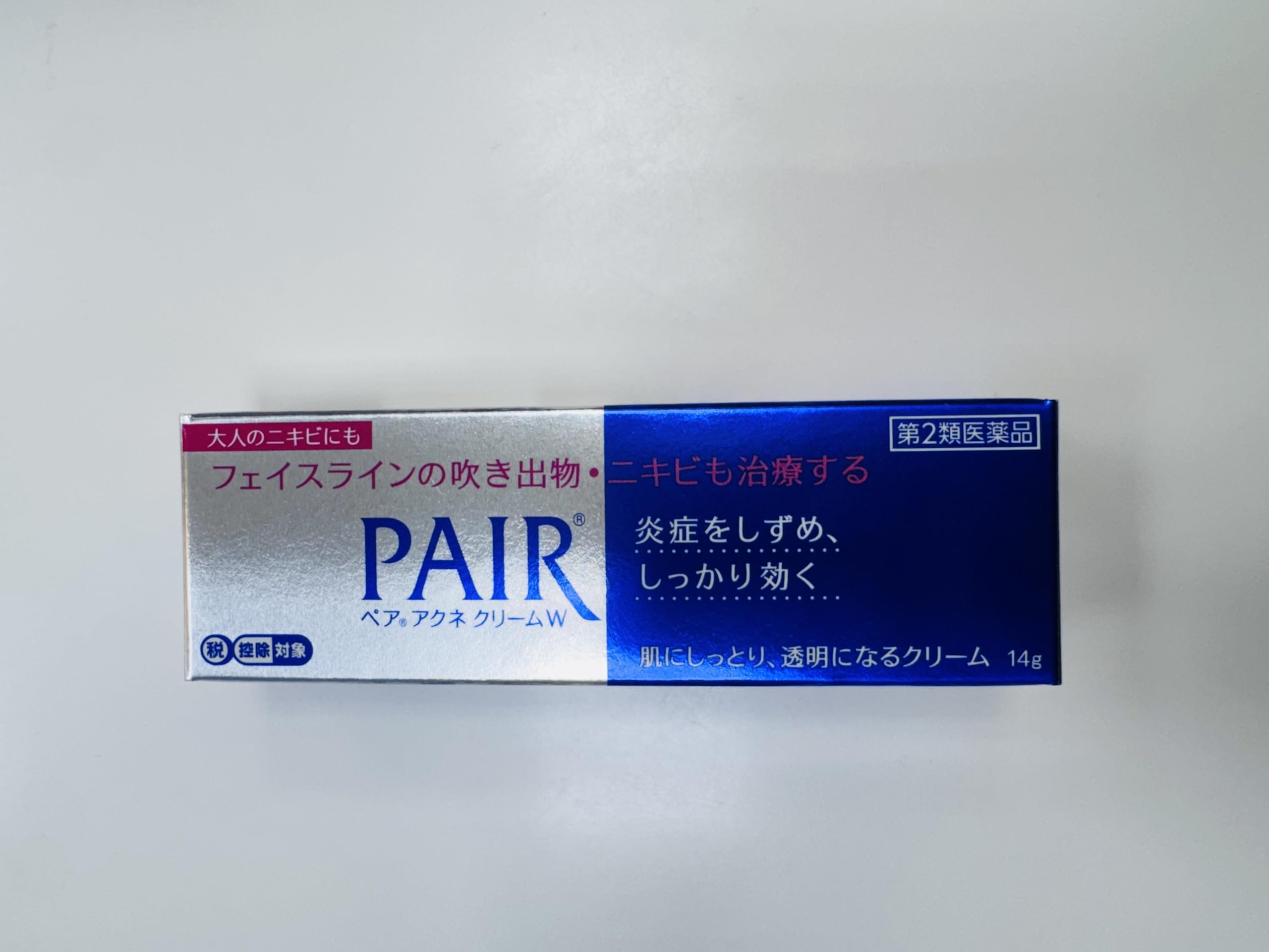 Japan Lion Pair Acne Cream packaging on display highlighting travel size 14g.