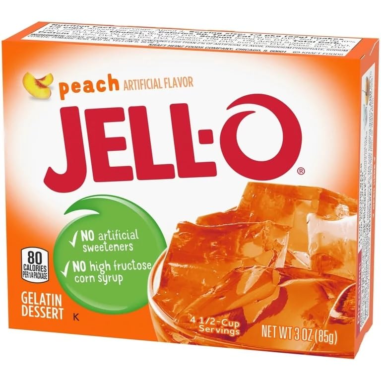 Pouring cold water into Jell-O Peach Gelatin to start setting.