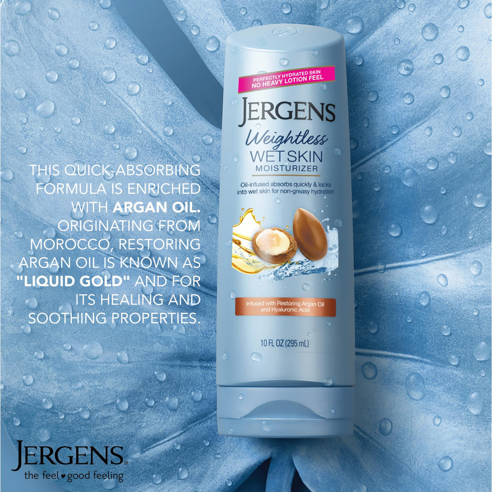 Hands massaging Jergens on wet skin during shower session.
