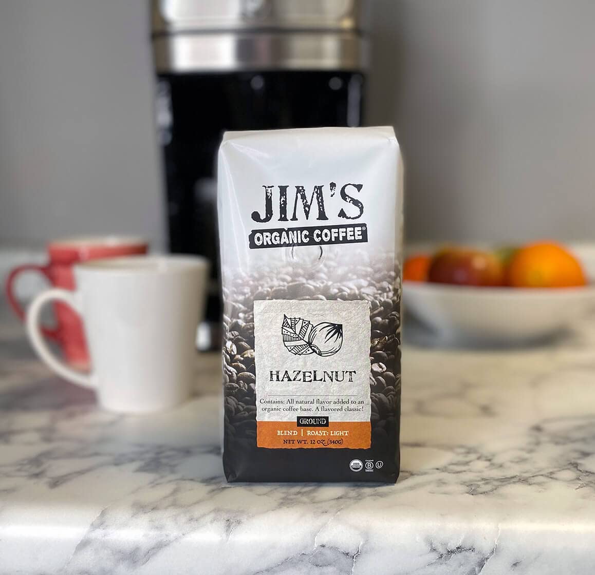 Jim's Organic Hazelnut bag back details roast date and sustainable sourcing for flavor you can trust.