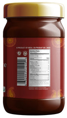 Pouring tamarind paste from the bottle for curries and noodles.