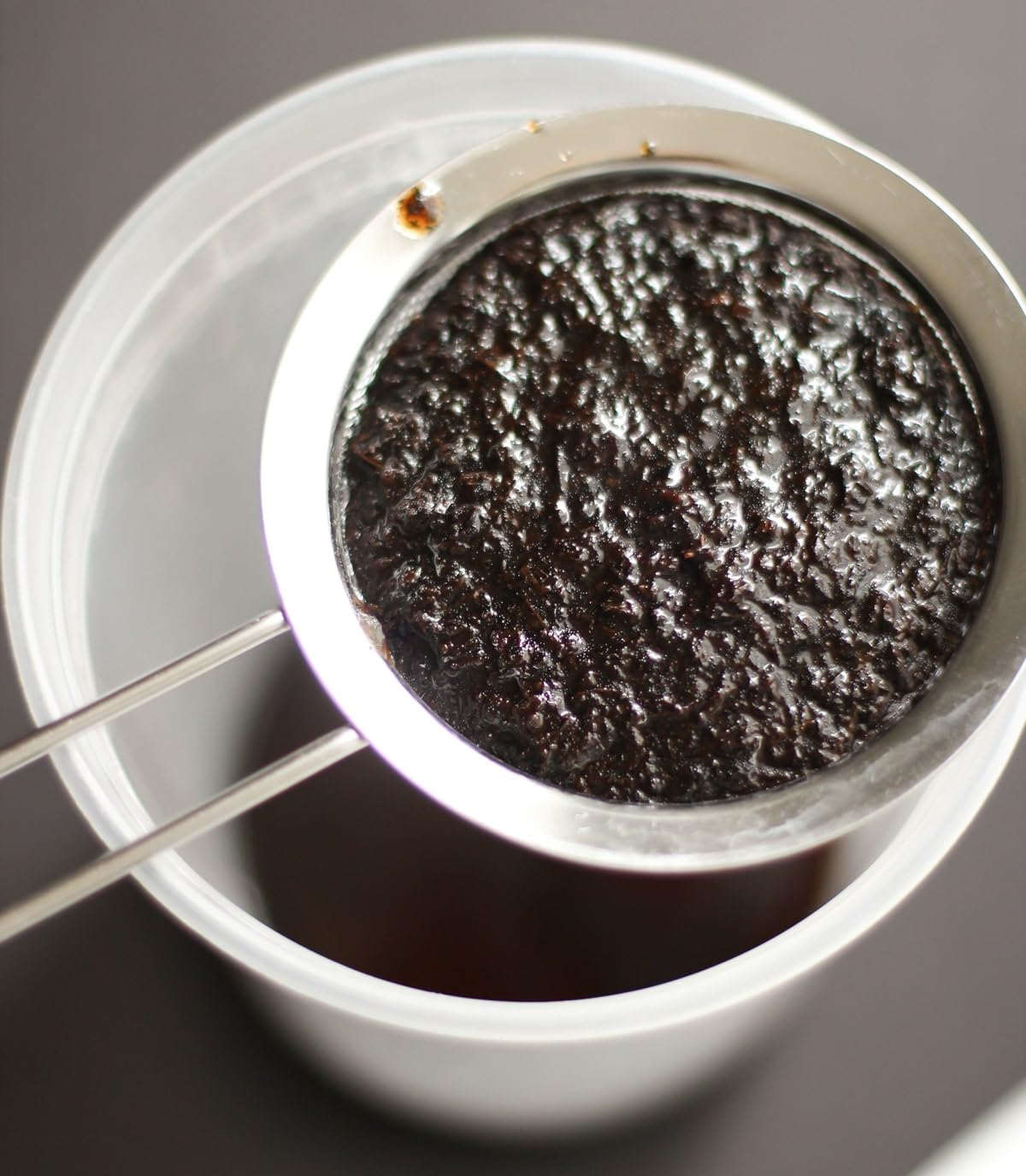 Closeup of JL Gourmet Imports paste jar highlighting real vanilla specks