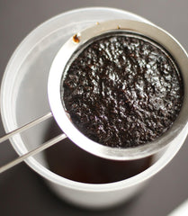Closeup of JL Gourmet Imports paste jar highlighting real vanilla specks