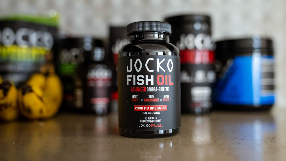 Jocko Fuel Omega-3 capsules beside gym bag for daily use