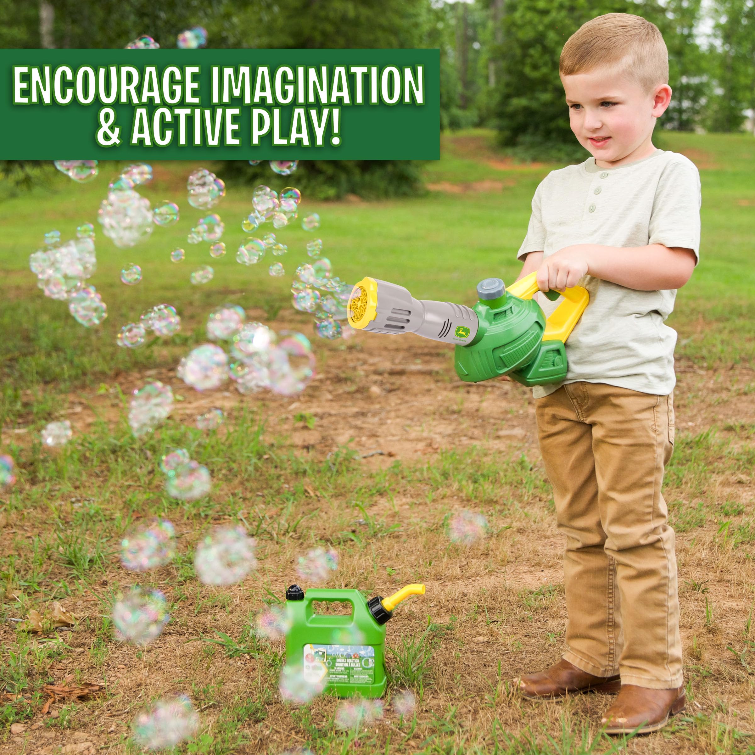 John Deere bubble leaf blower toy being activated by the trigger for bubbles.
