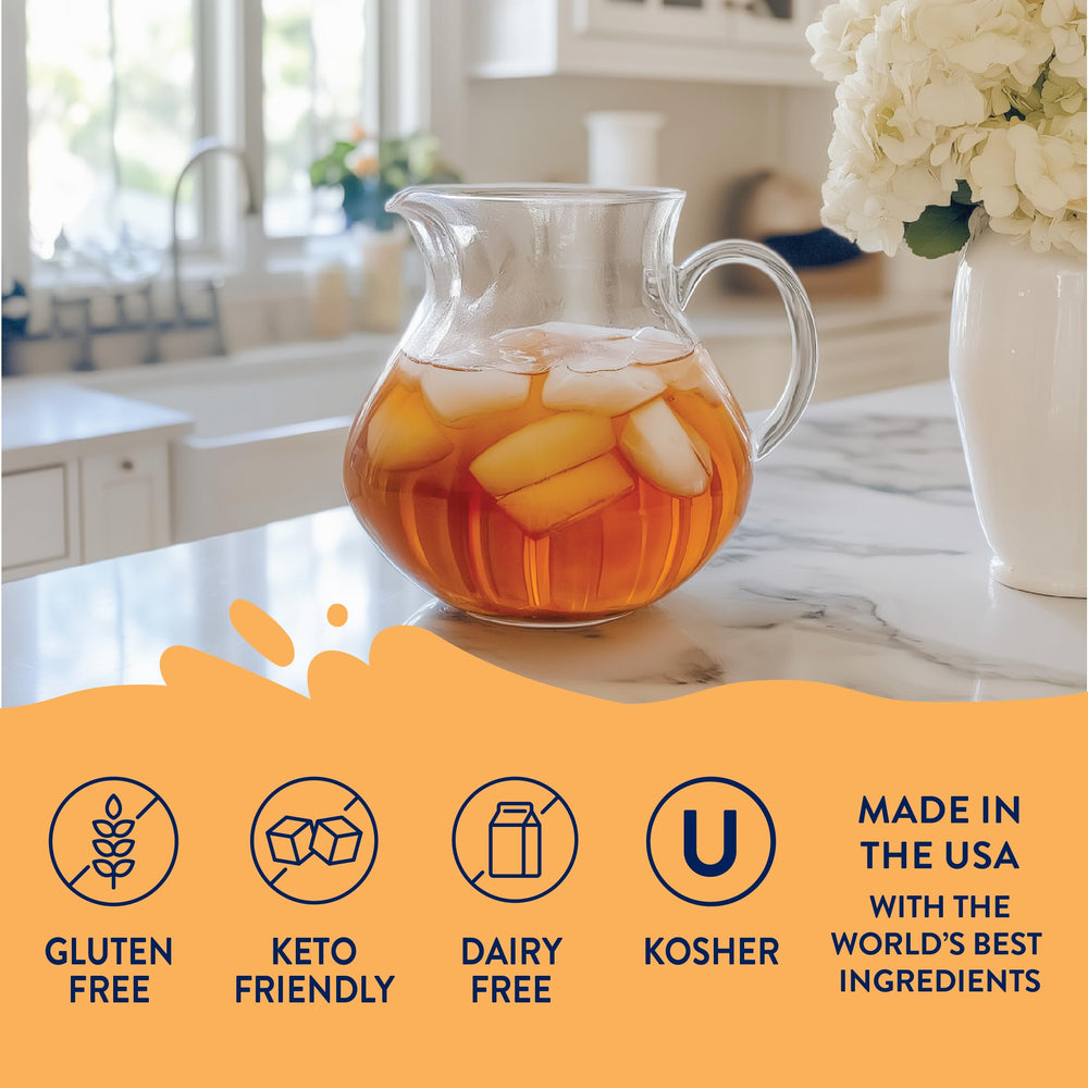 A bottle of Jordan's Skinny Mixes Sugar Free Syrup beside a tall glass of iced tea