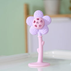 Joyfulia Sunnyflower teether in action, baby rattling for sensory engagement.