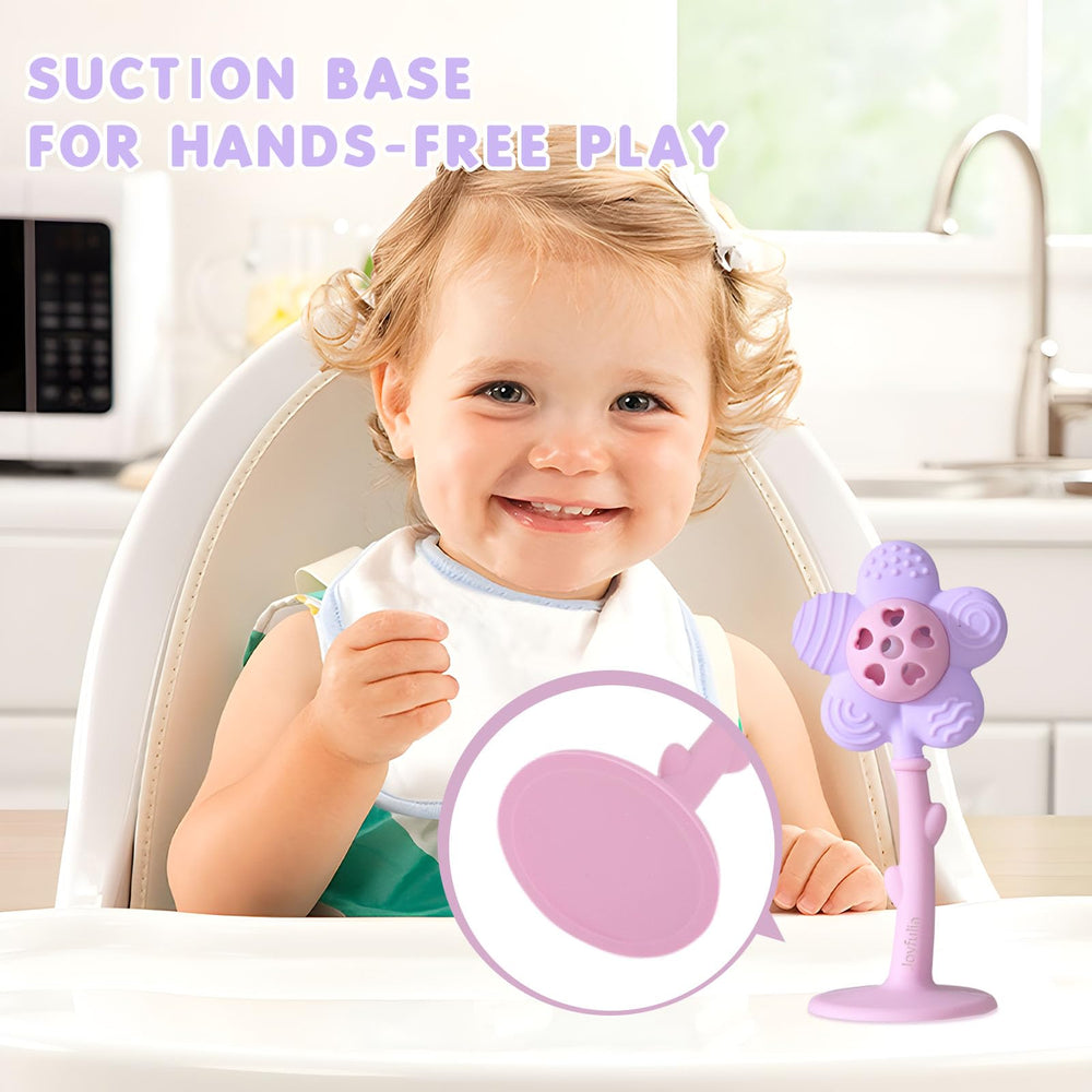 Joyfulia Sunnyflower teether with suction base attached to a flat surface.