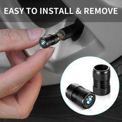 Four black caps installed on a vehicle for a cohesive look.