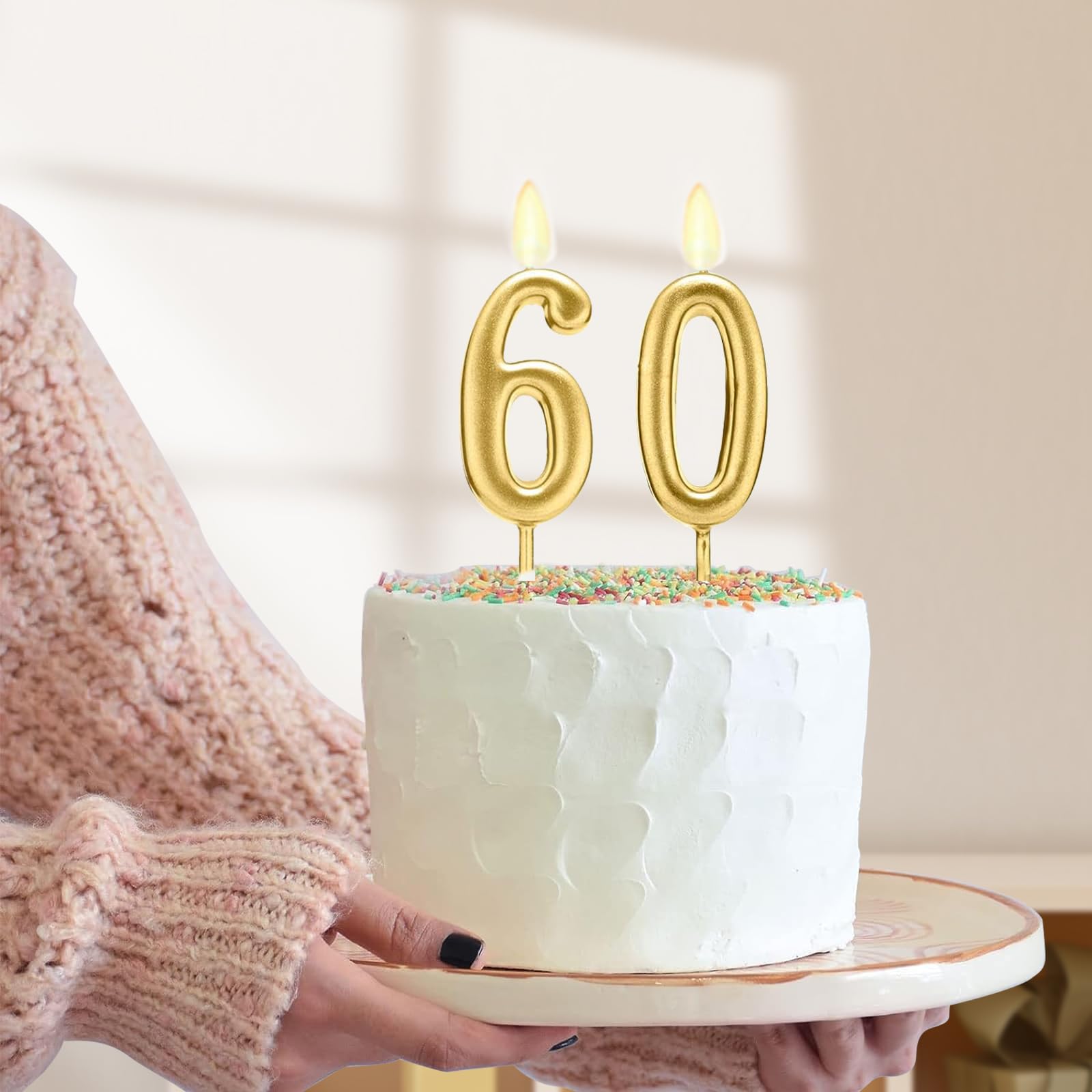 Juesly 60th birthday setup shows coordinated gold decor idea