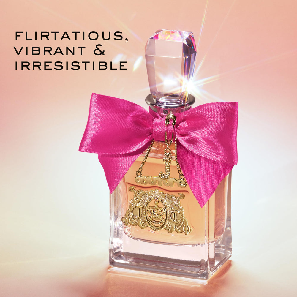 Juicy Couture Viva La Juicy EDP bottle with gold cap on a marble surface.