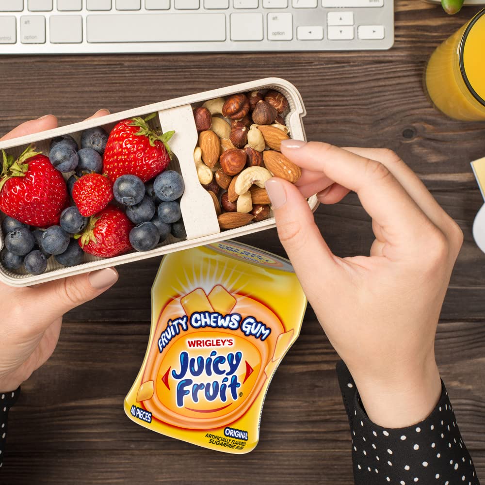 Juicy Fruit Gum sugar-free bottle opening shows convenient dispensing for quick refreshment.