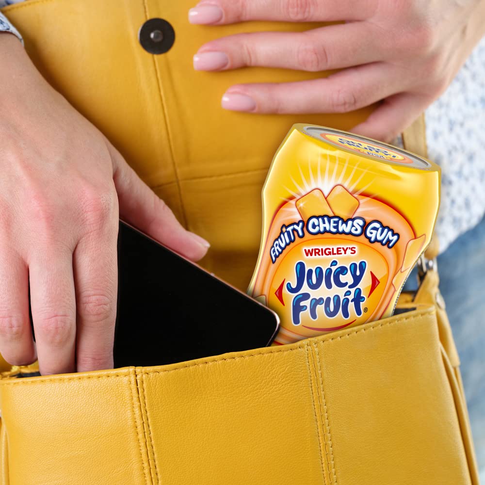 Juicy Fruit Gum sugar-free gum in hand illustrates portable snacking and mood-lifting flavor.