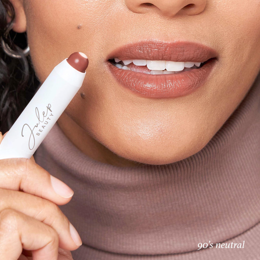 Julep It's Balm Tint swatch image demonstrates sheer gloss finish and vitamin E core.