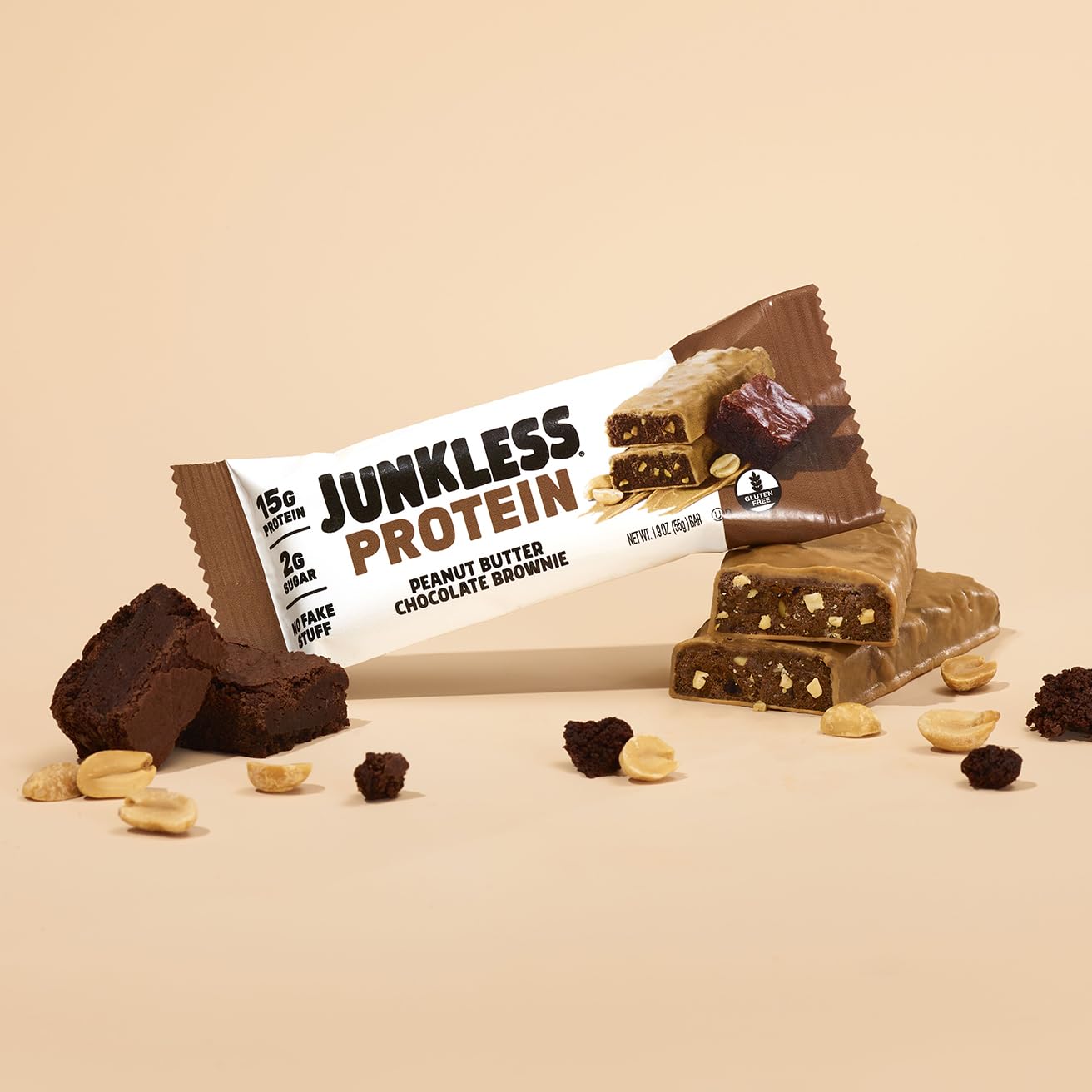 JUNKLESS Peanut Butter Chocolate Brownie Bar on-the-go snack beside gym bag.