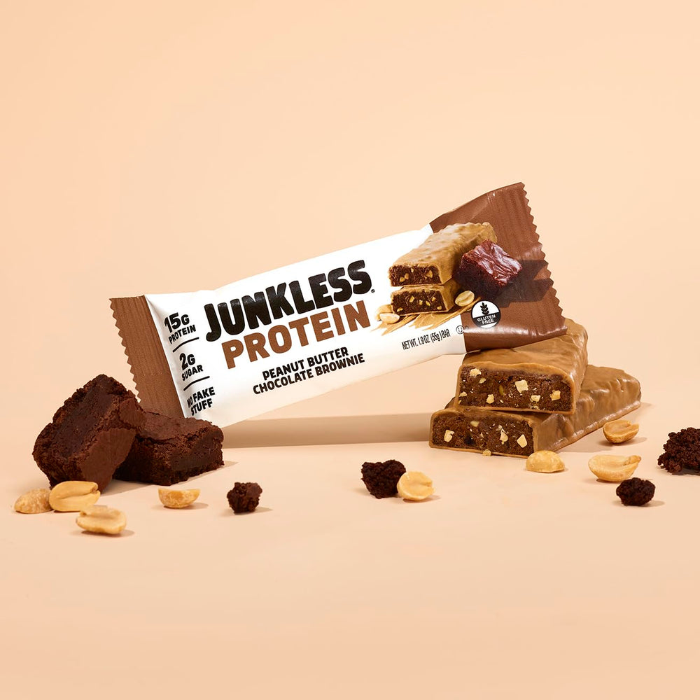 JUNKLESS Peanut Butter Chocolate Brownie Bar on-the-go snack beside gym bag.