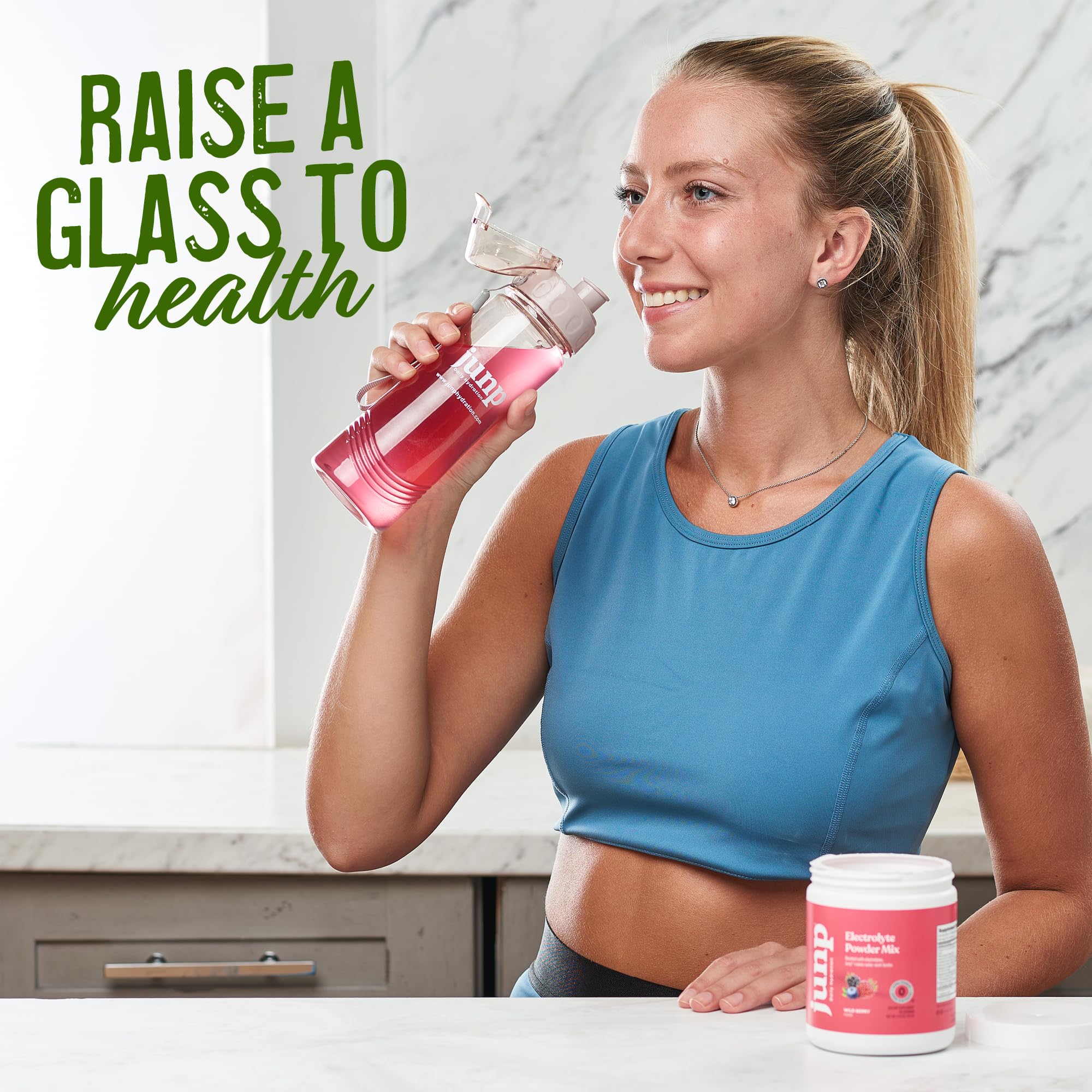 JUNP Lemonade Electrolyte Powder tub and scoop on the kitchen counter.