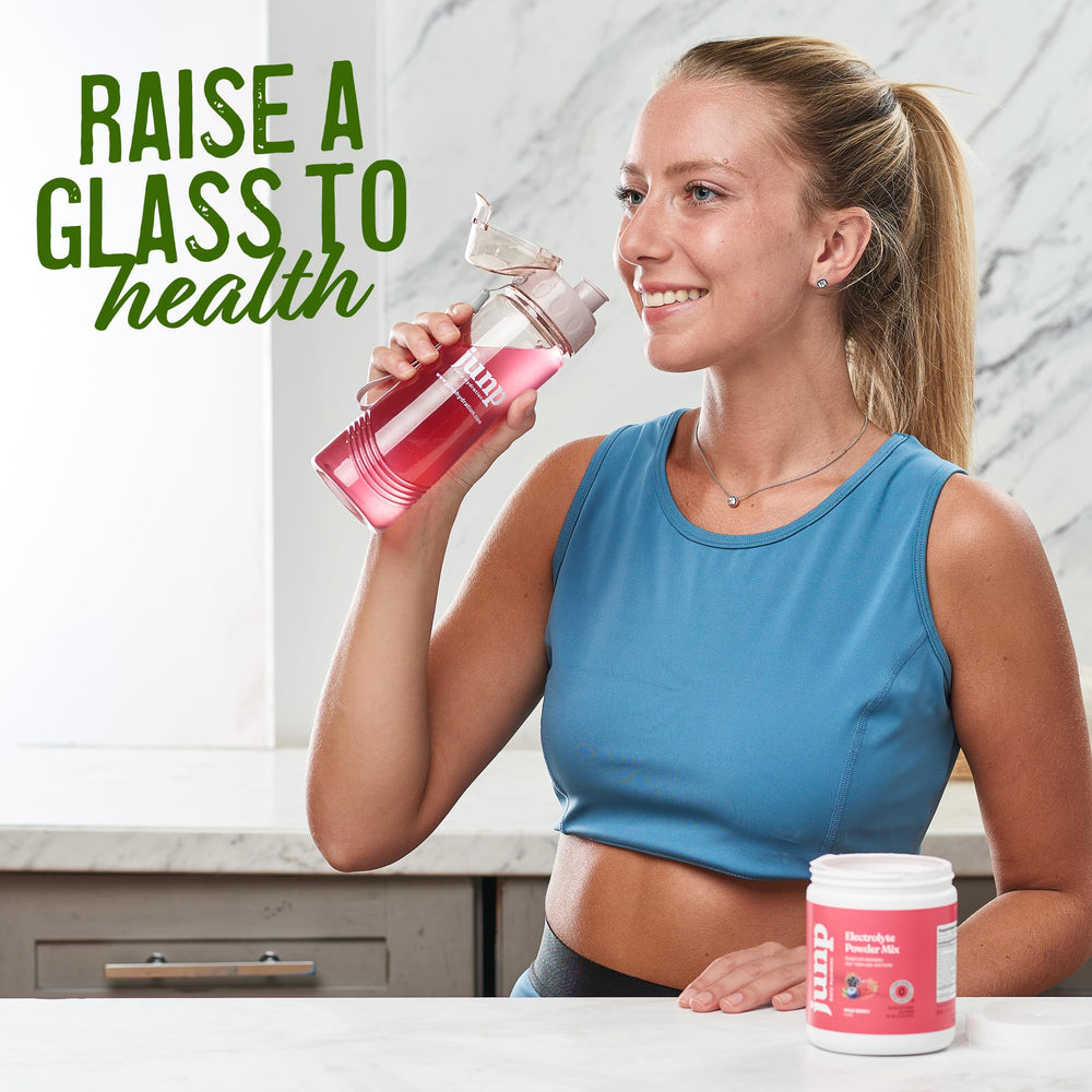 JUNP Lemonade Electrolyte Powder tub and scoop on the kitchen counter.