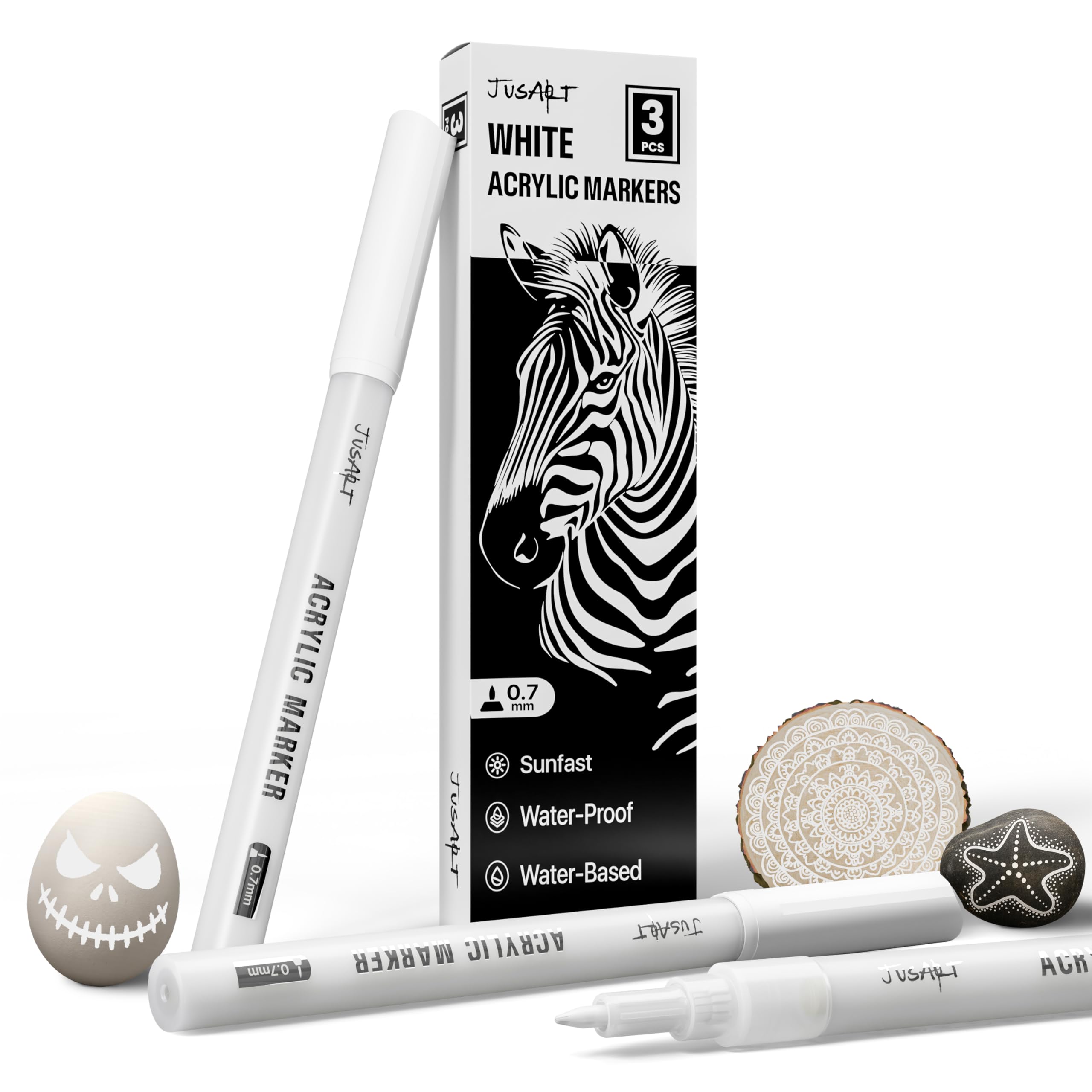 JusArt white marker 0.7mm tip enabling precise detailing on dark surfaces.