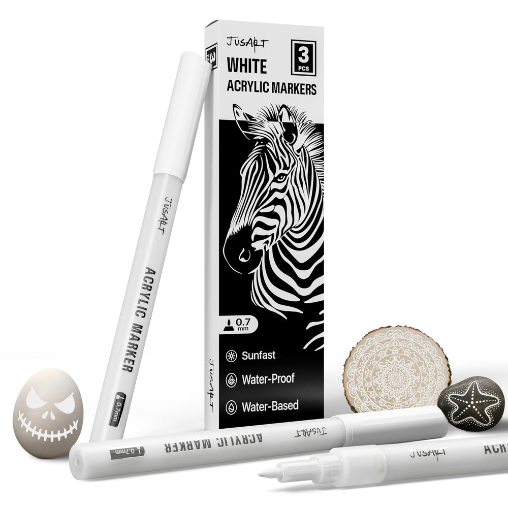 JusArt white marker 0.7mm tip enabling precise detailing on dark surfaces.