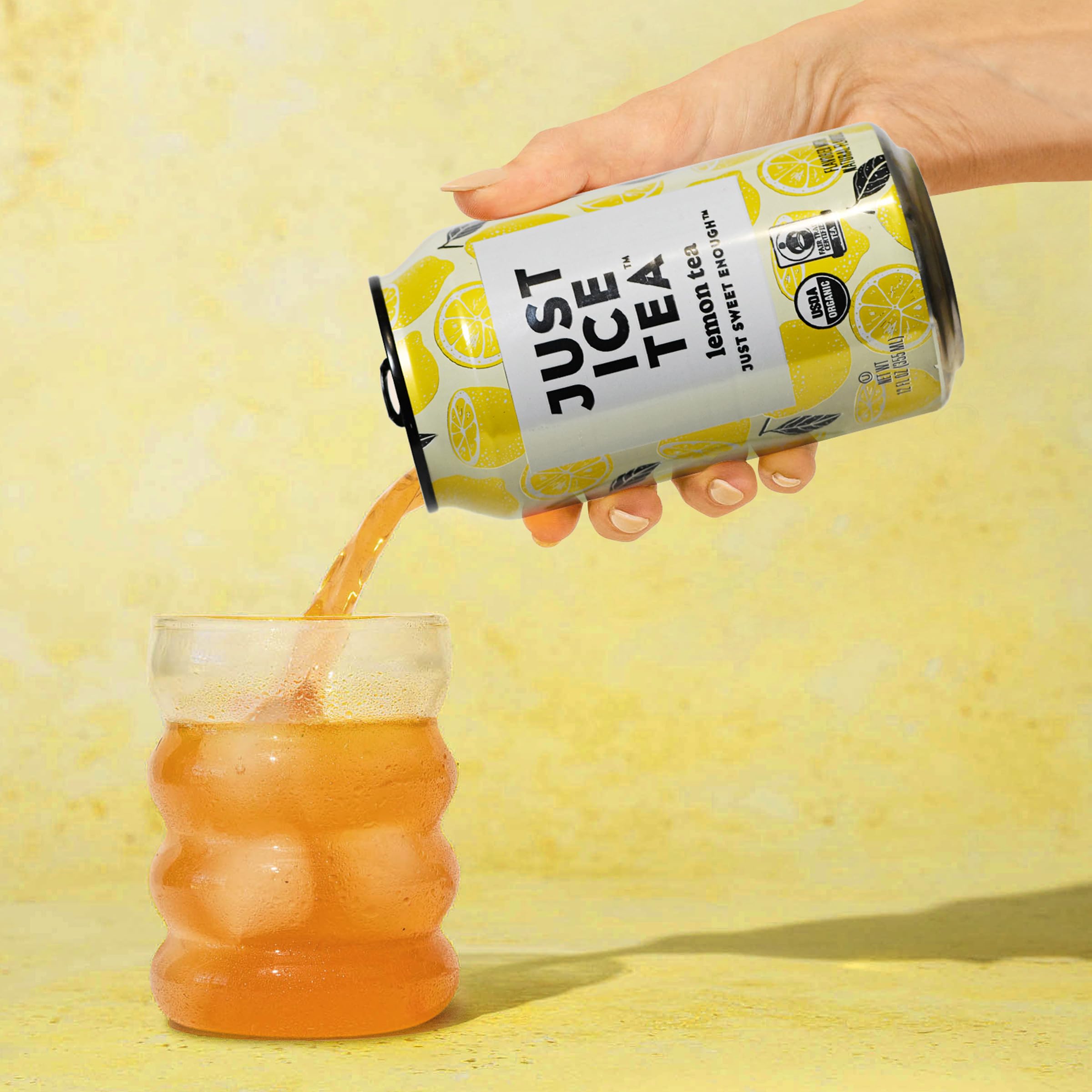 Just Ice Tea lemon-flavored black iced tea can on a desk for a desk-side refreshment