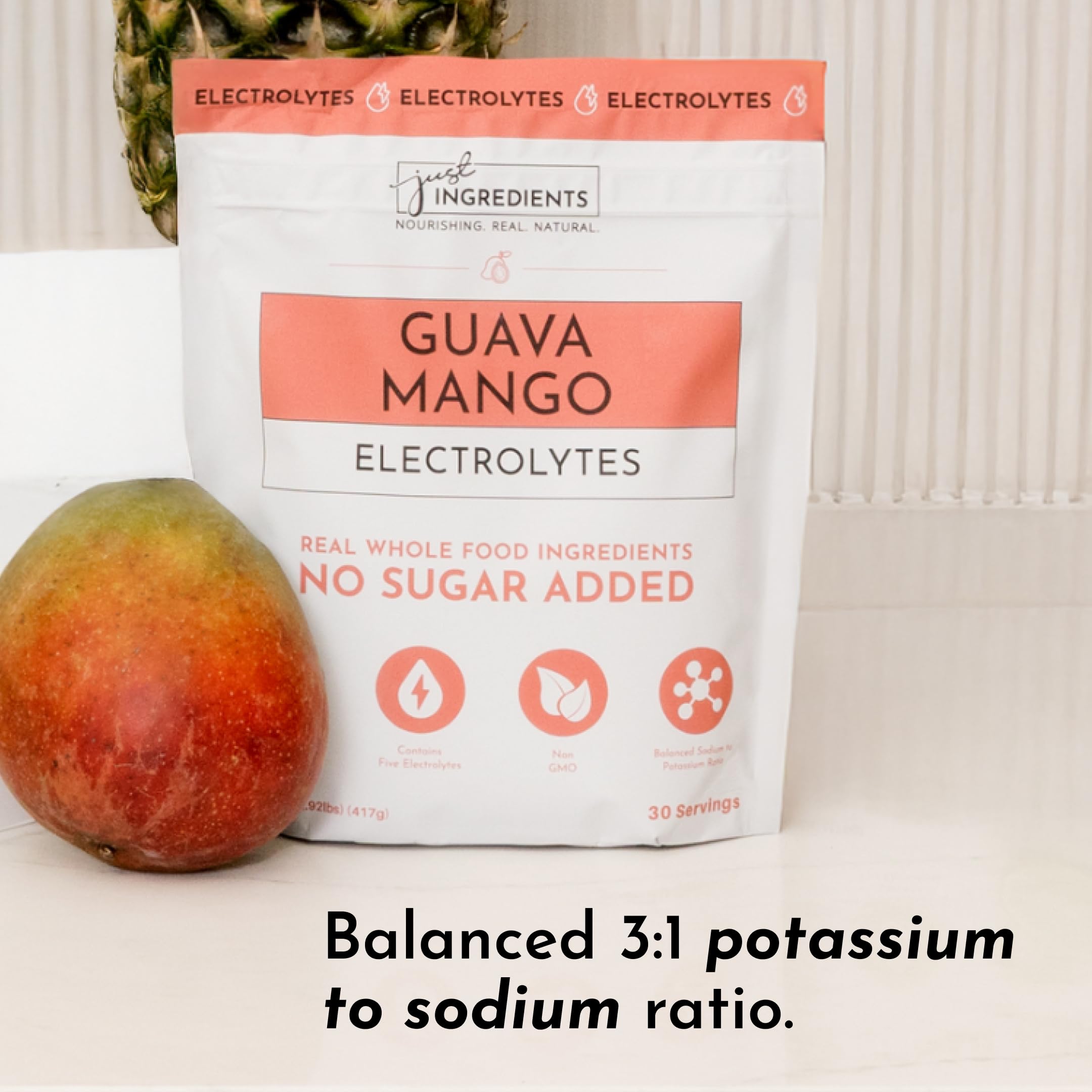 JUST INGREDIENTS Guava Mango Electrolytes glass ready to drink after activity.