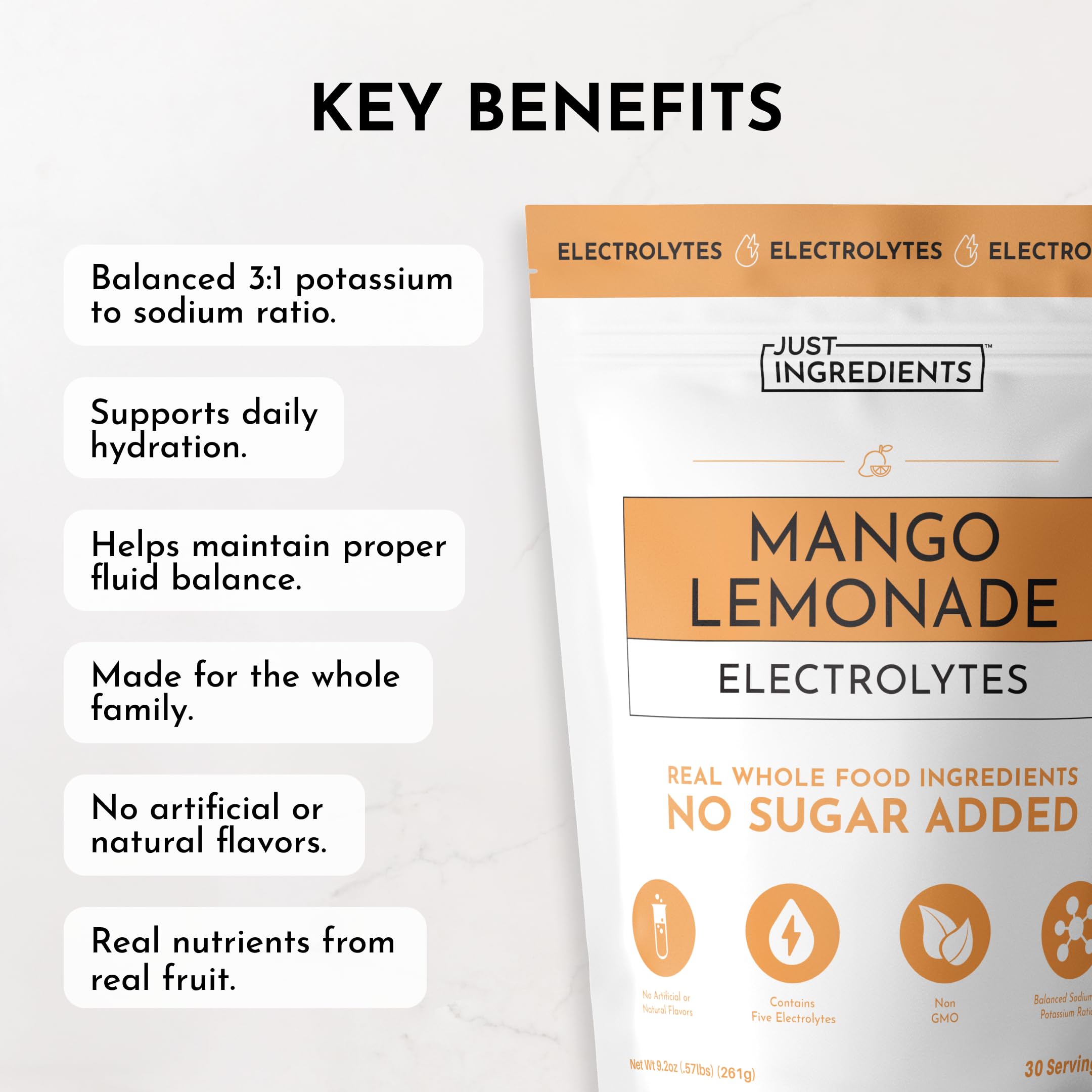 JUST INGREDIENTS Mango Lemonade electrolyte drink mix in a glass highlighting tropical flavor