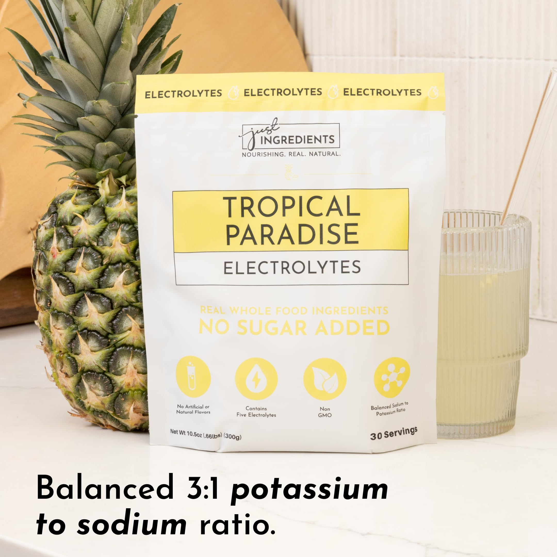 JUST INGREDIENTS Tropical Paradise Electrolytes Glass with prepared drink after a workout.