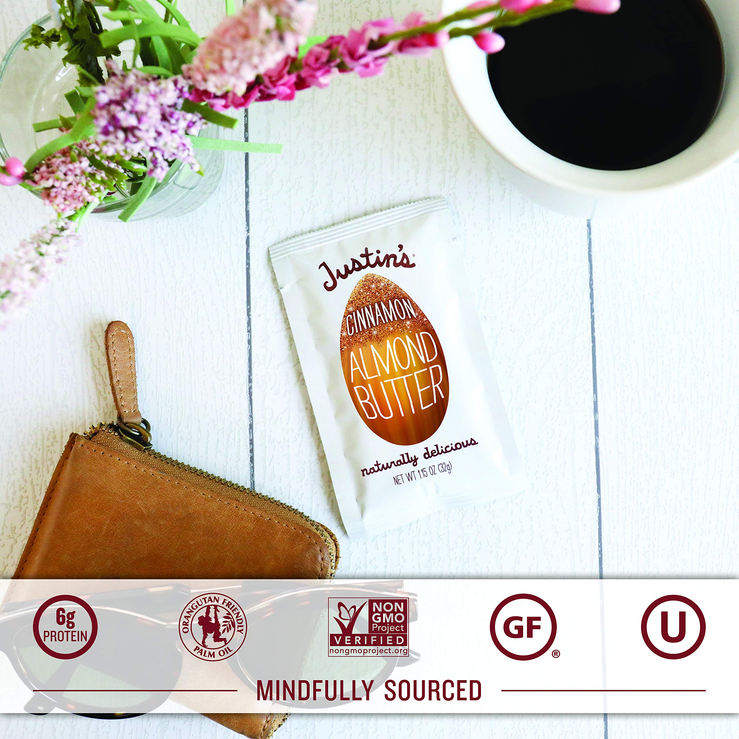 Justins Almond Cinnamon Squeeze Pack in hand, perfect travel snack.
