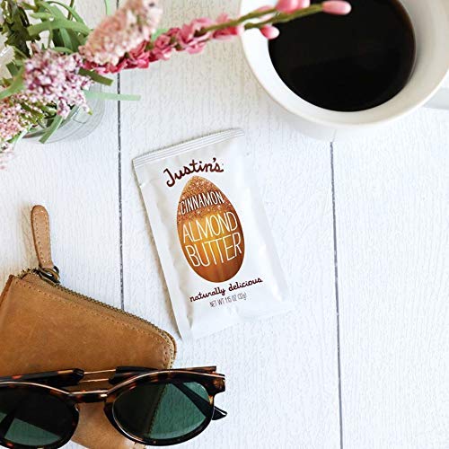 Justins Almond Cinnamon Squeeze Pack on kitchen counter, family-friendly snack.
