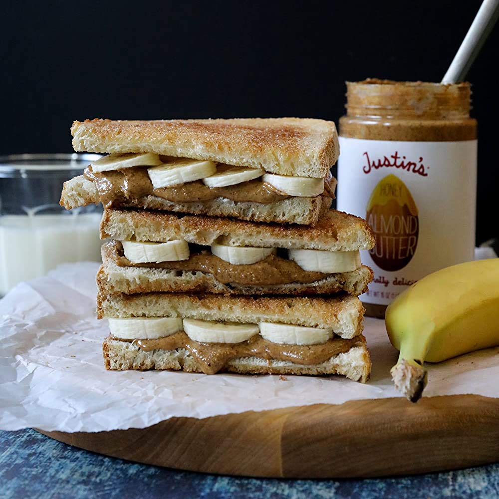 Justin's Honey Almond Butter jar on counter for easy use.