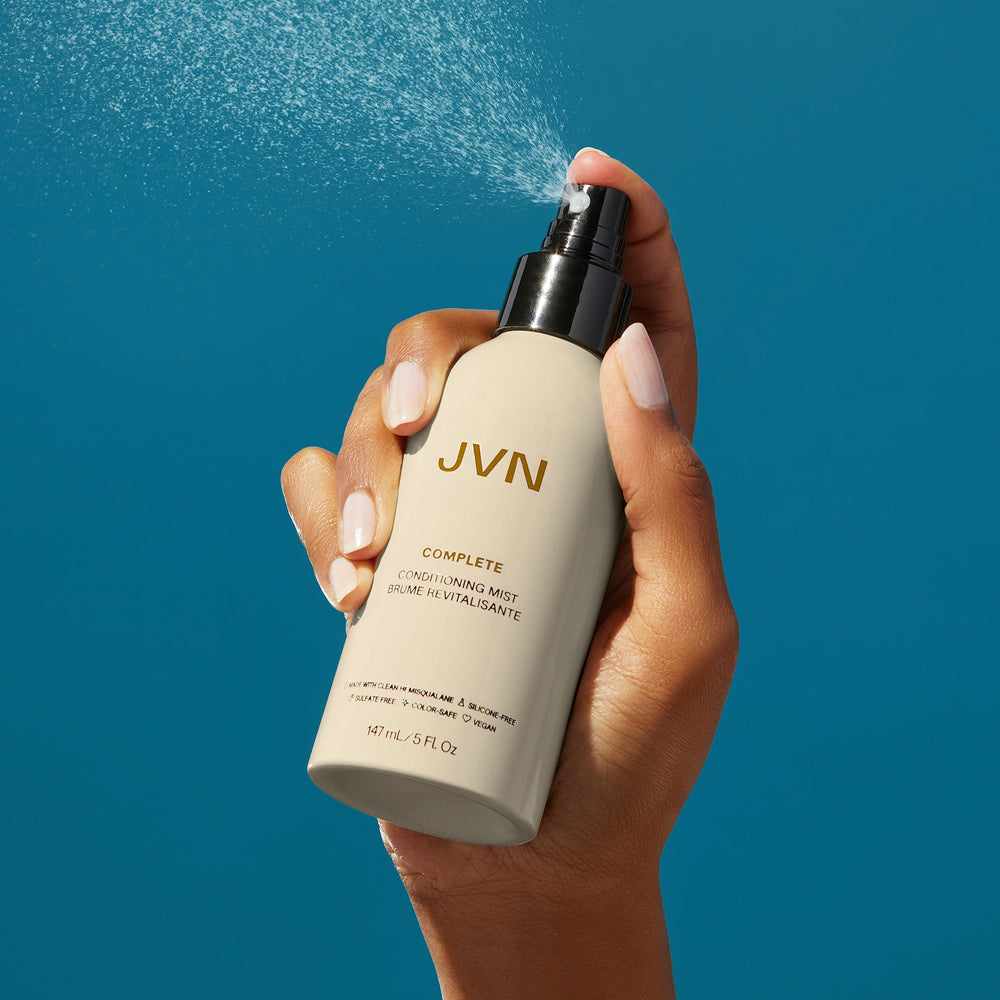 Travel-friendly packaging beside a passport for on-the-go care.