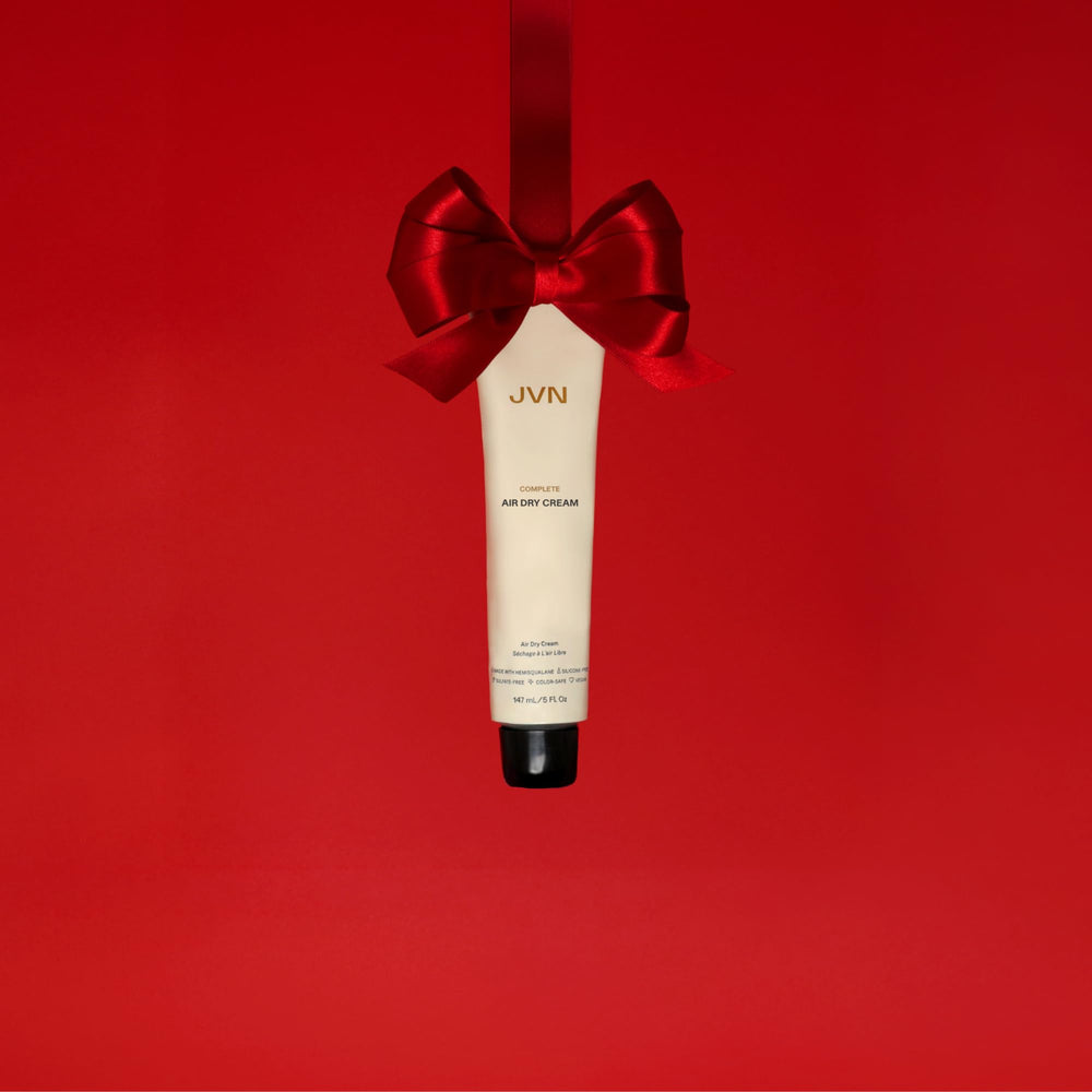 JVN No Heat Air Dry Cream on hair texture showing natural definition and shine.