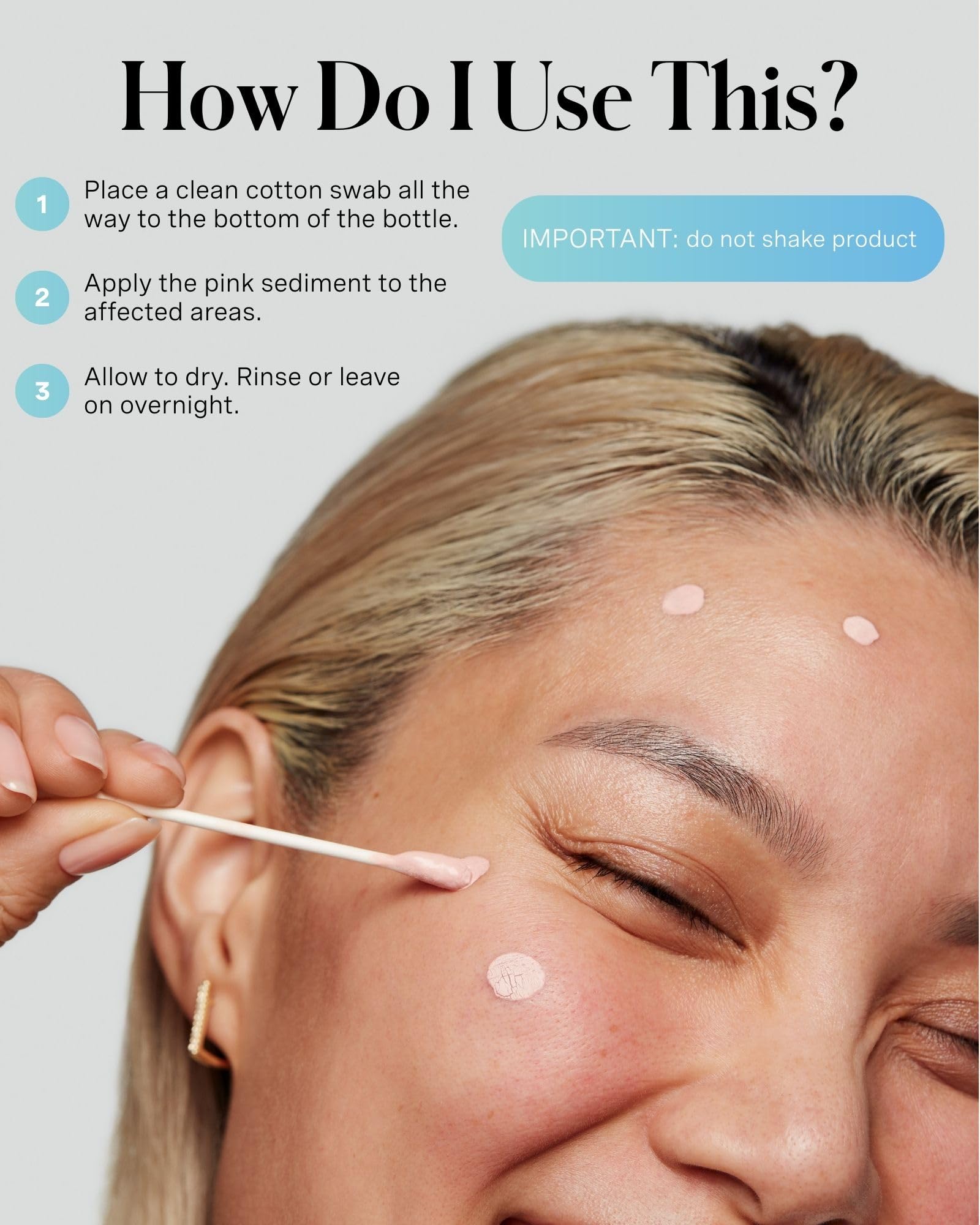 Hands applying EradiKate spot-treatment to a blemish