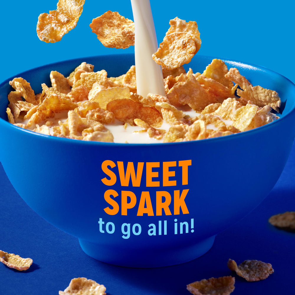 Kellogg's Frosted Flakes cups with milk ready for a quick breakfast.