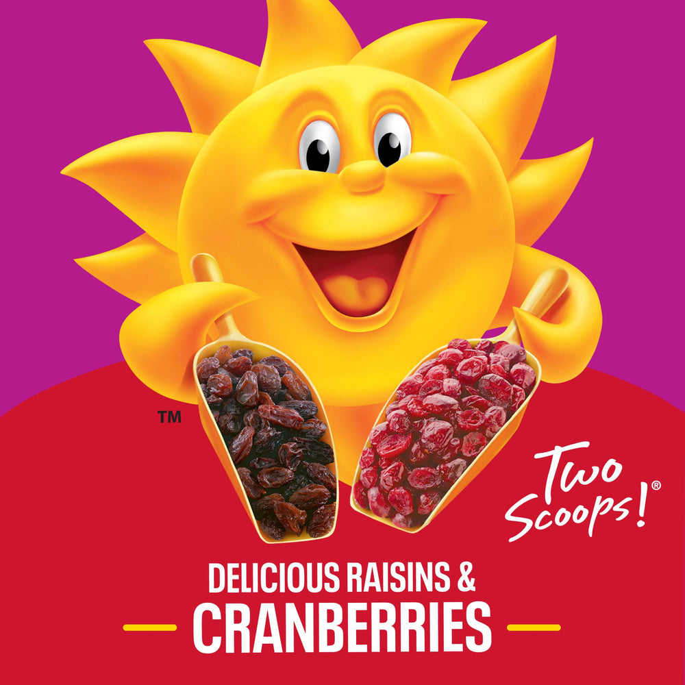 Pouring milk over Kellogg's Raisin Bran with Cranberries for a creamy start.