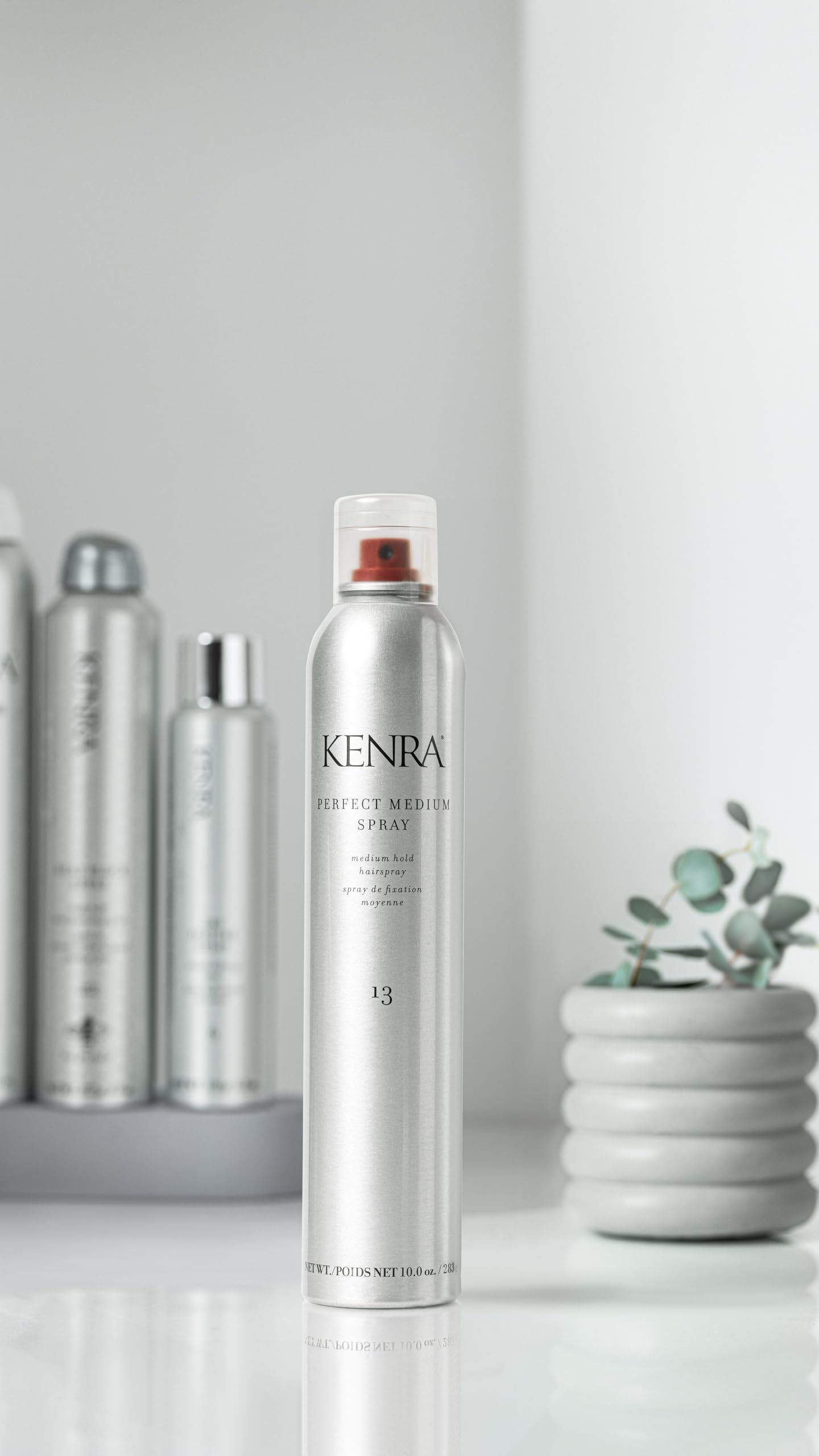Kenra Perfect Medium Spray in hands shows easy, quick application