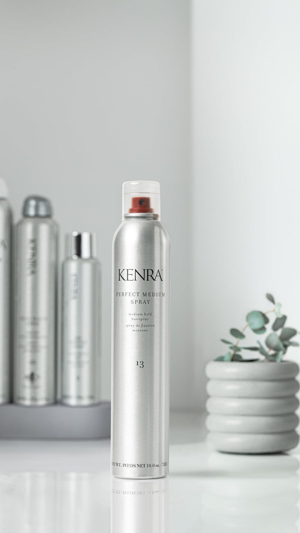 Kenra Perfect Medium Spray in hands shows easy, quick application