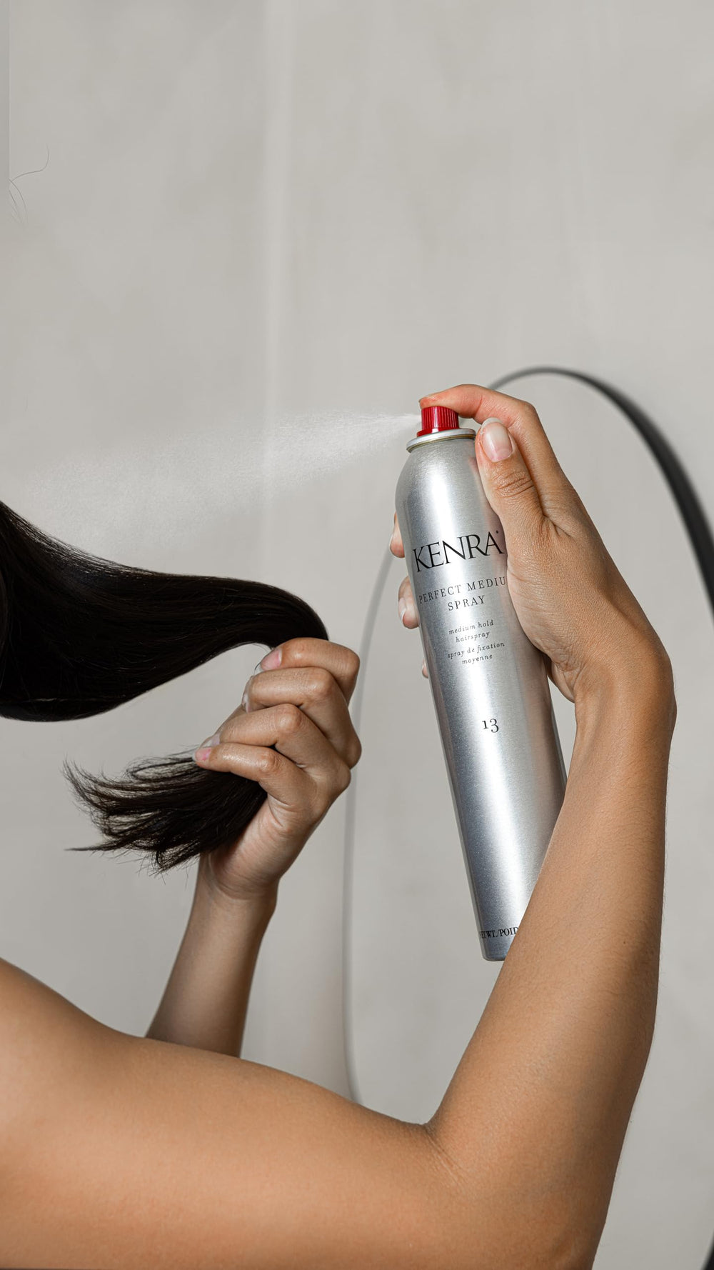 Moveable hold from Kenra Perfect Medium Spray supports brush-through styling.