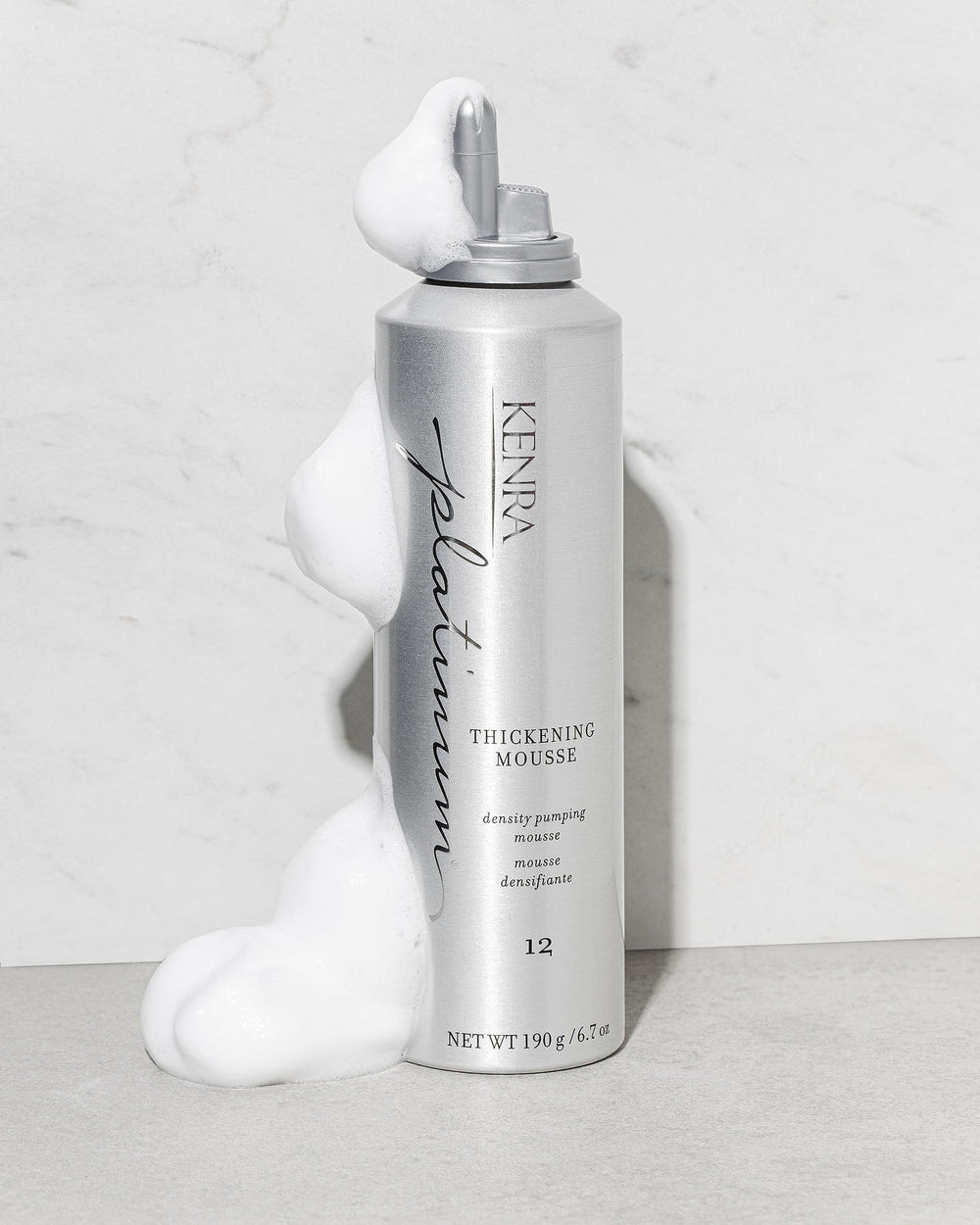 Kenra Platinum Thickening Mousse on damp hair ready for styling.