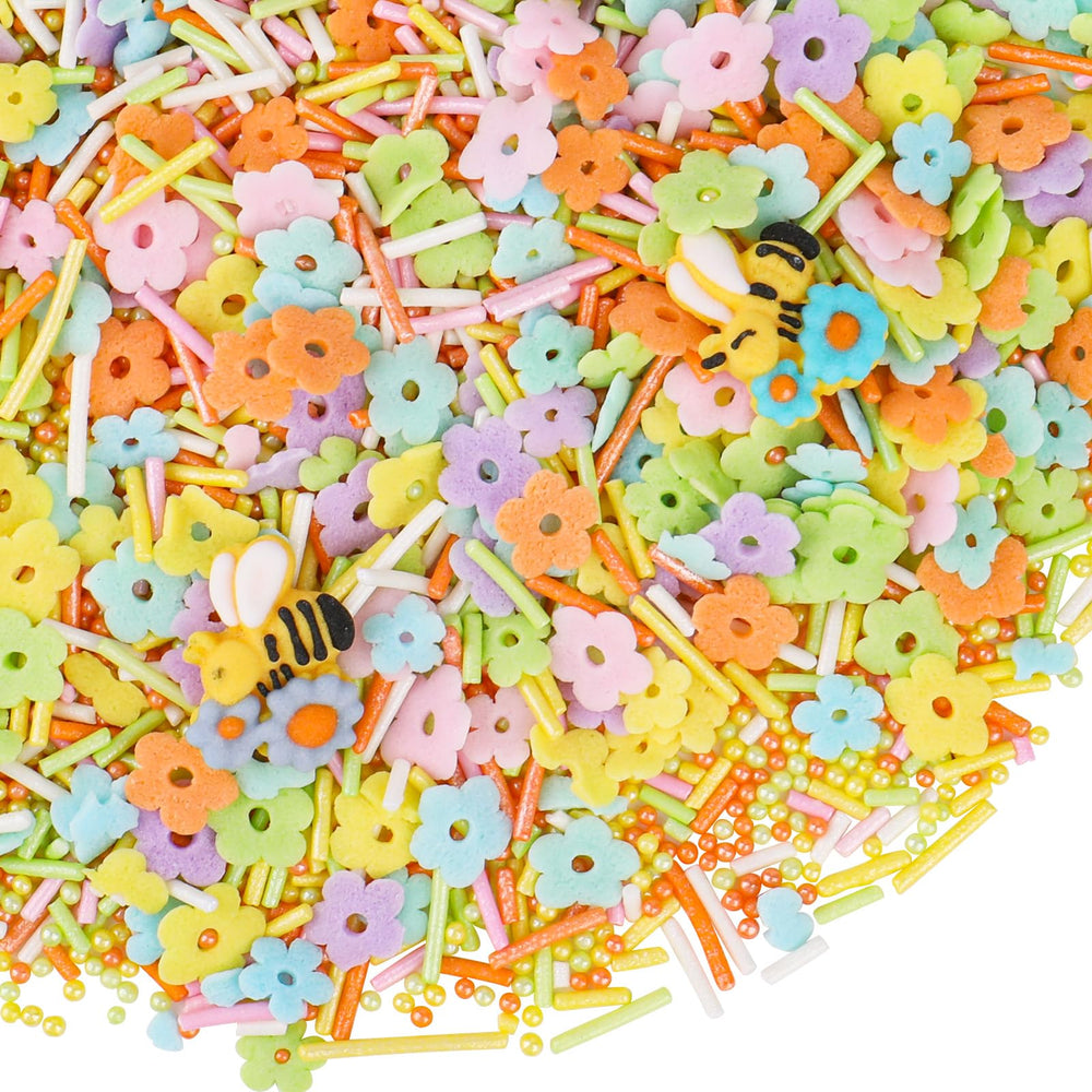 Kercky cake pops glow with garden-party charm and colorful sprinkles.