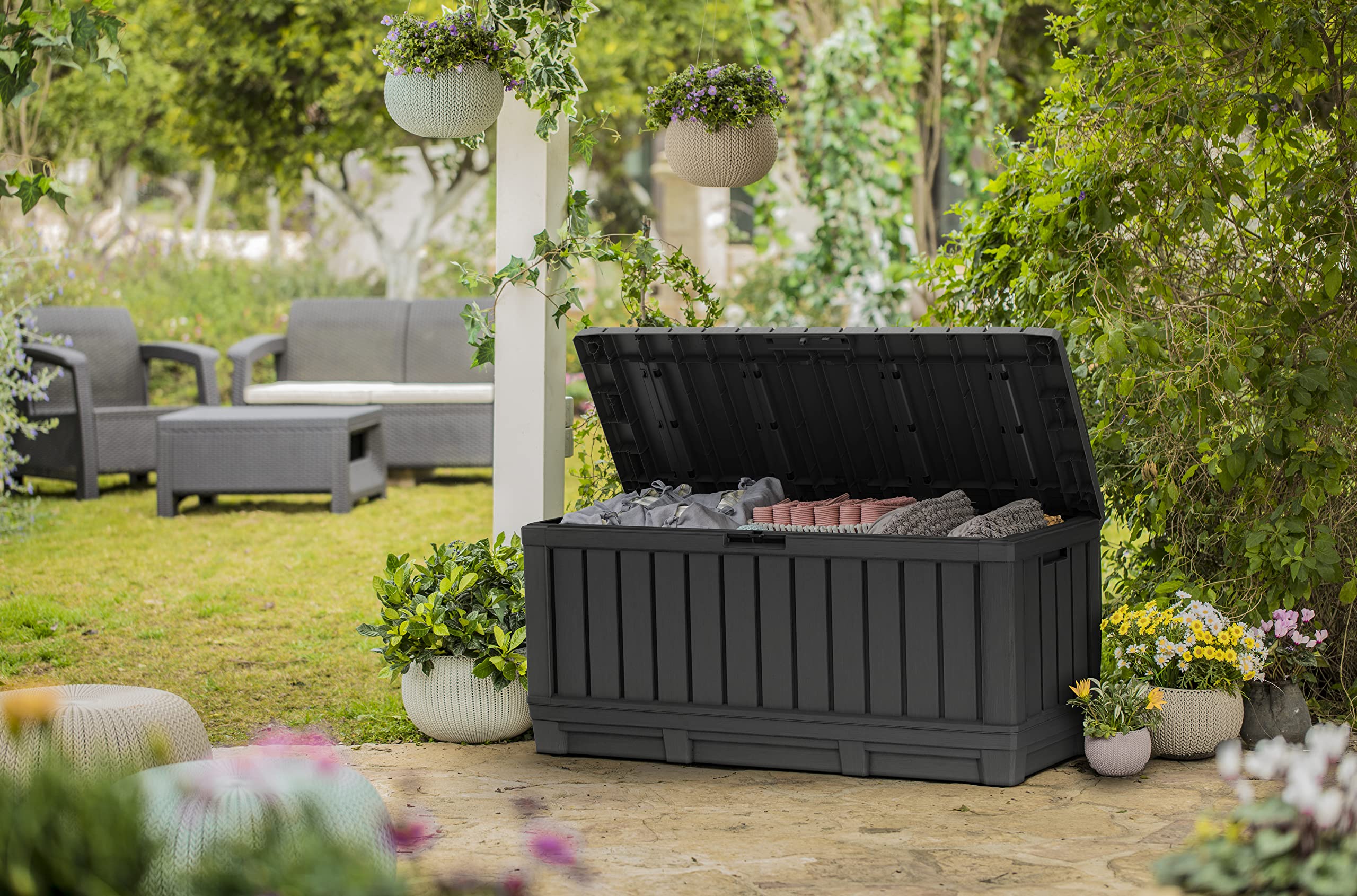 Keter Kentwood 92G deck box fits cushions toys towels for garage or patio storage.
