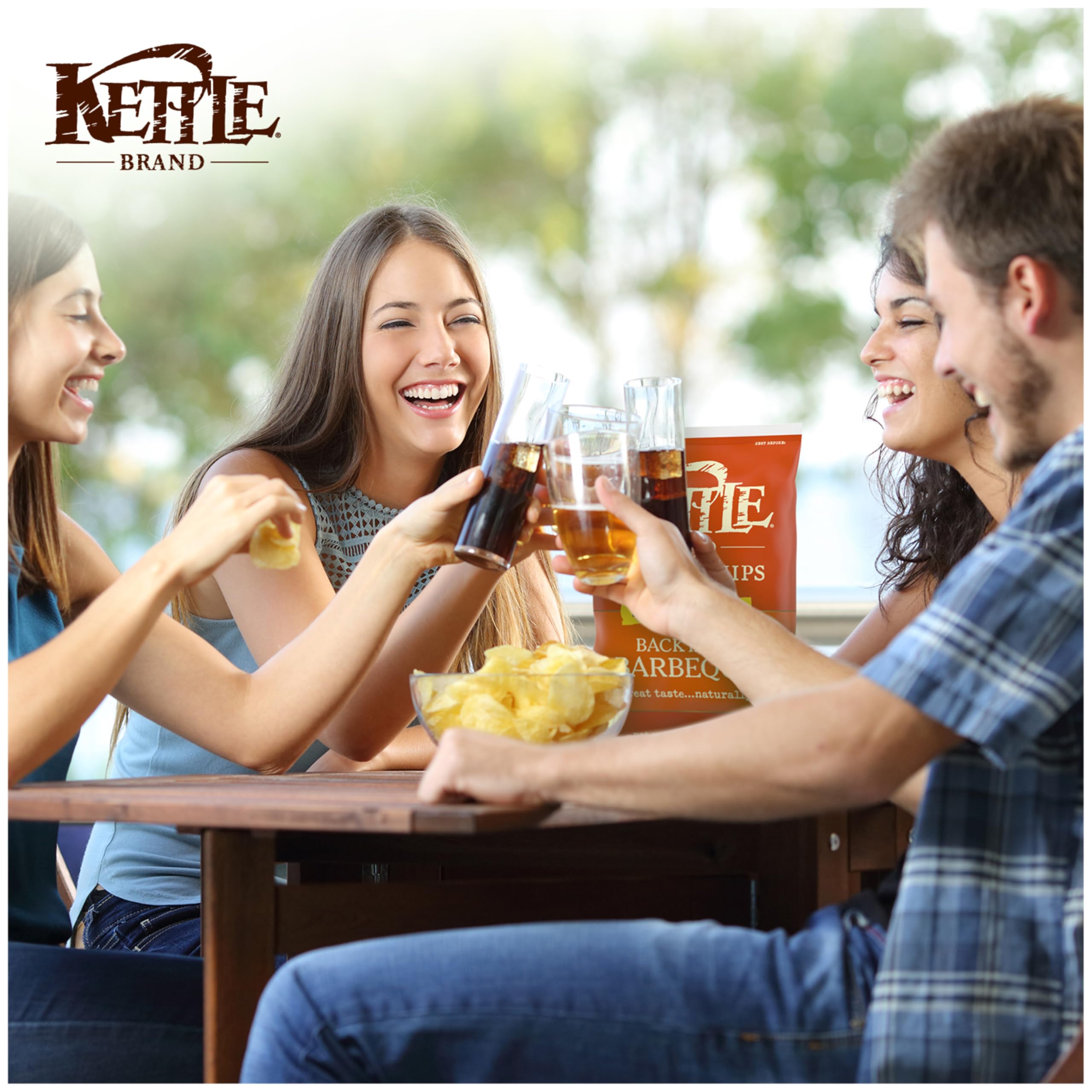 Kettle Brand chips beside grill and condiments, lifestyle shot for summer barbecues