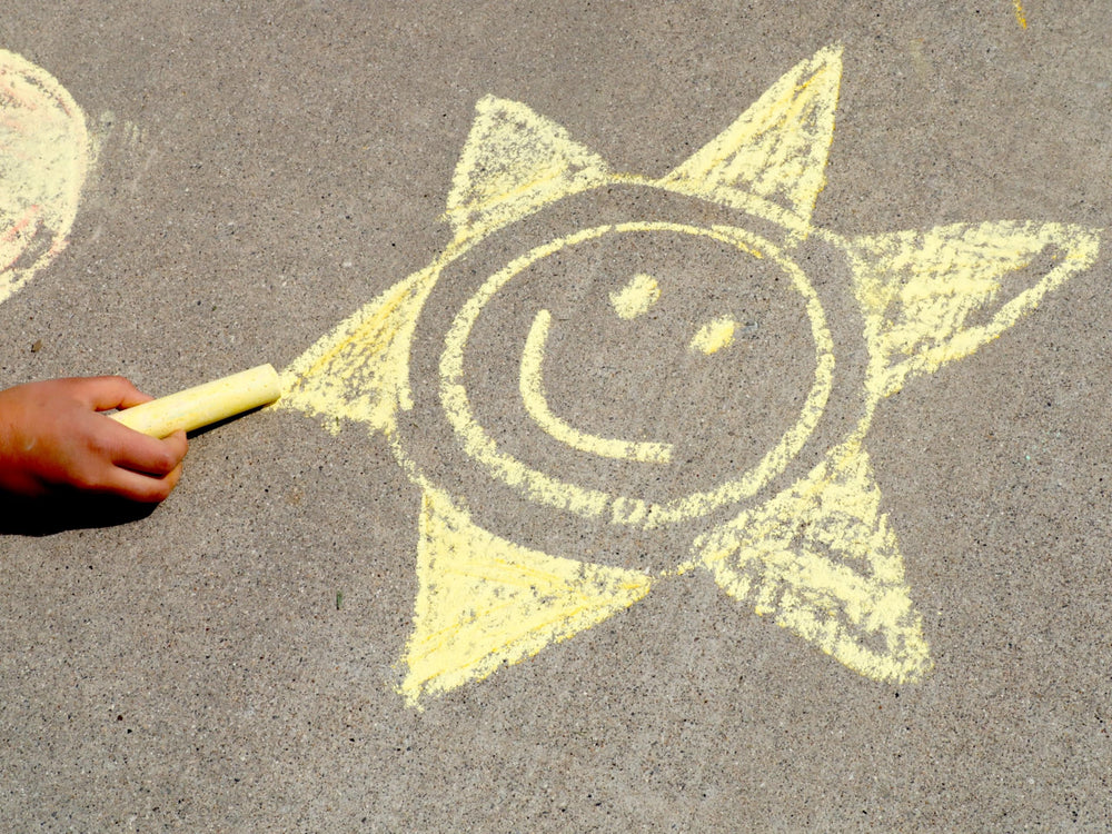 Kid Made Modern outdoor chalk on driveway or sidewalk—dustless, clean lines with easy wipe-away.