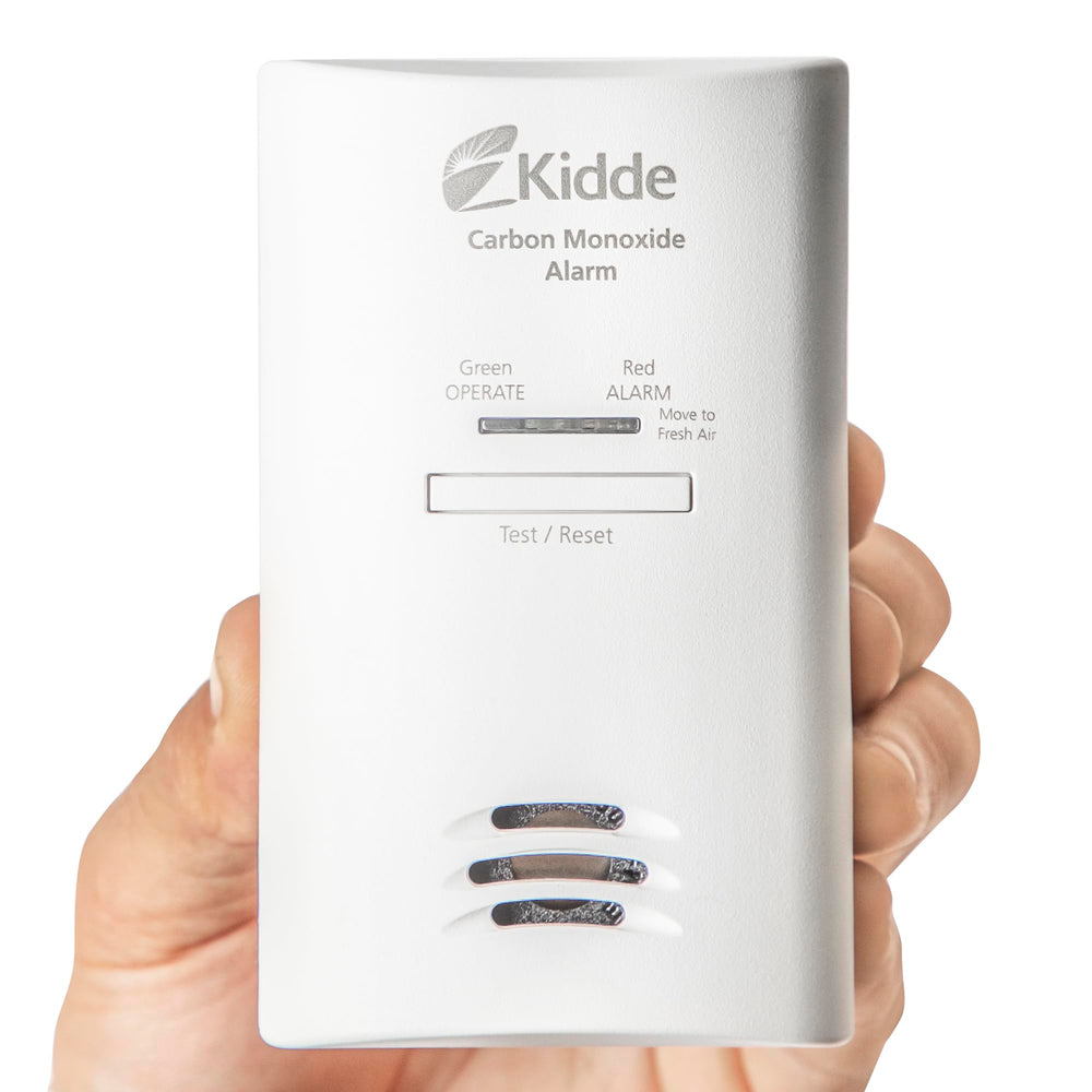 Kidde detector test-hush button in use for quick testing or quieting alarms
